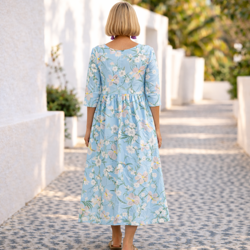 Blue summer floral dress, back view with gathered waist and 3/4 sleeves