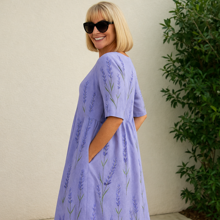 Lavender midi dress with vertical botanical print, three-quarter sleeves, gathered waist