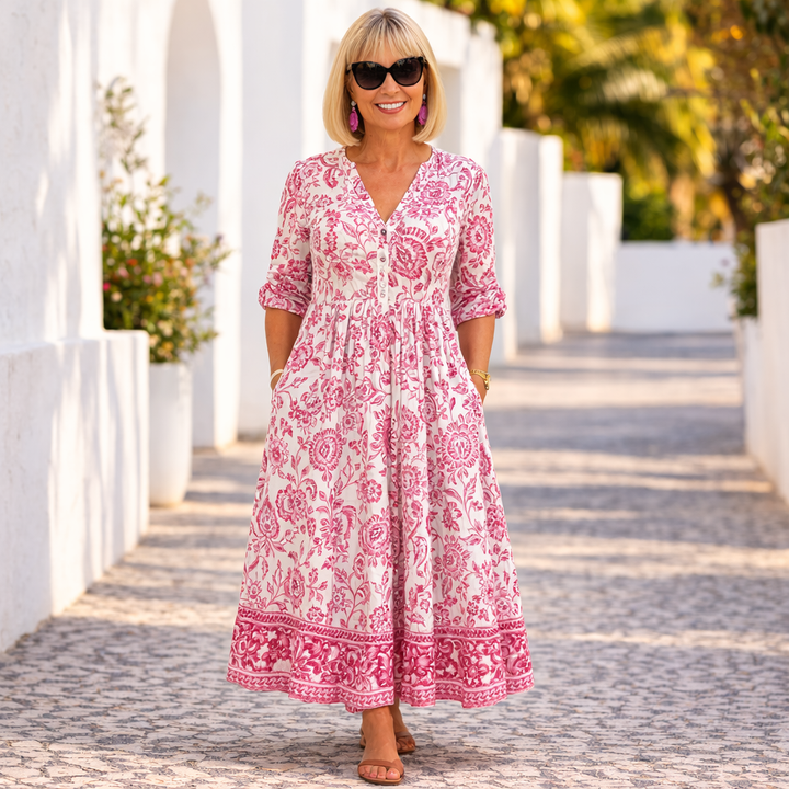 Pink floral tiered maxi dress with V-neck and rolled 3/4 sleeves