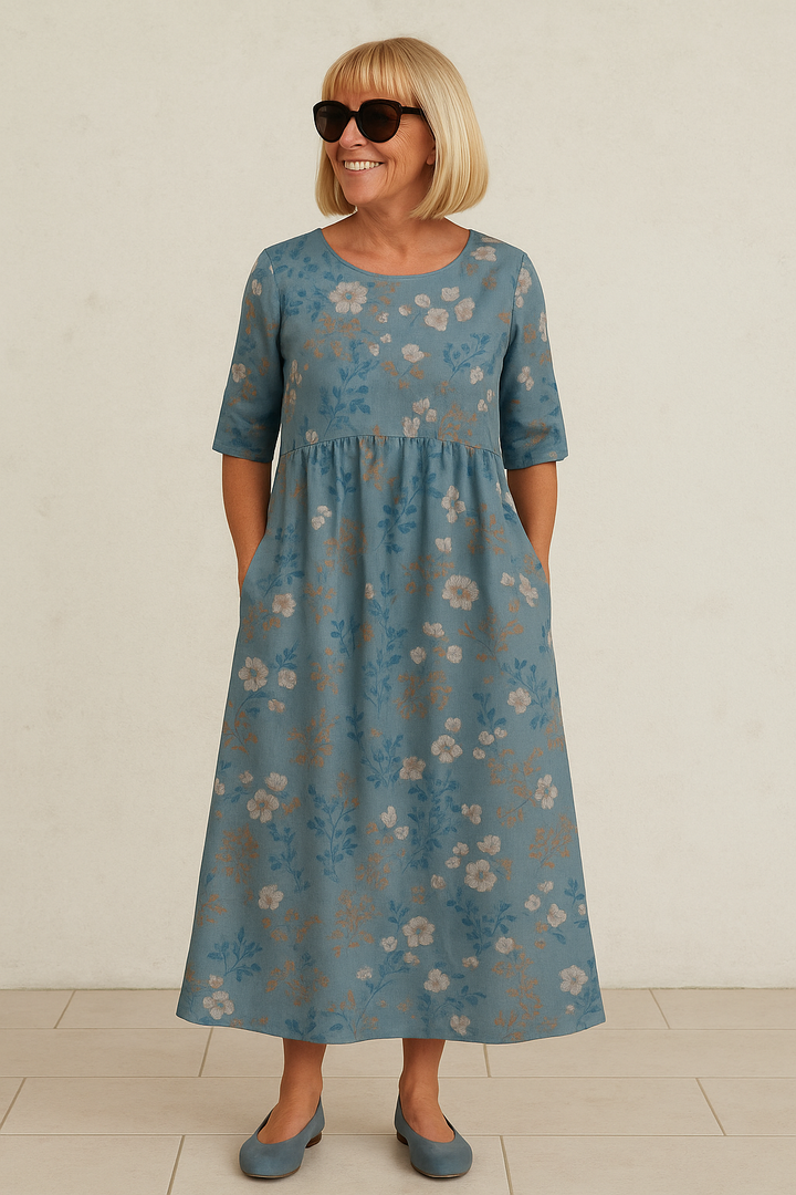 Blue midi dress with small flower print, short sleeves, gathered skirt fullness