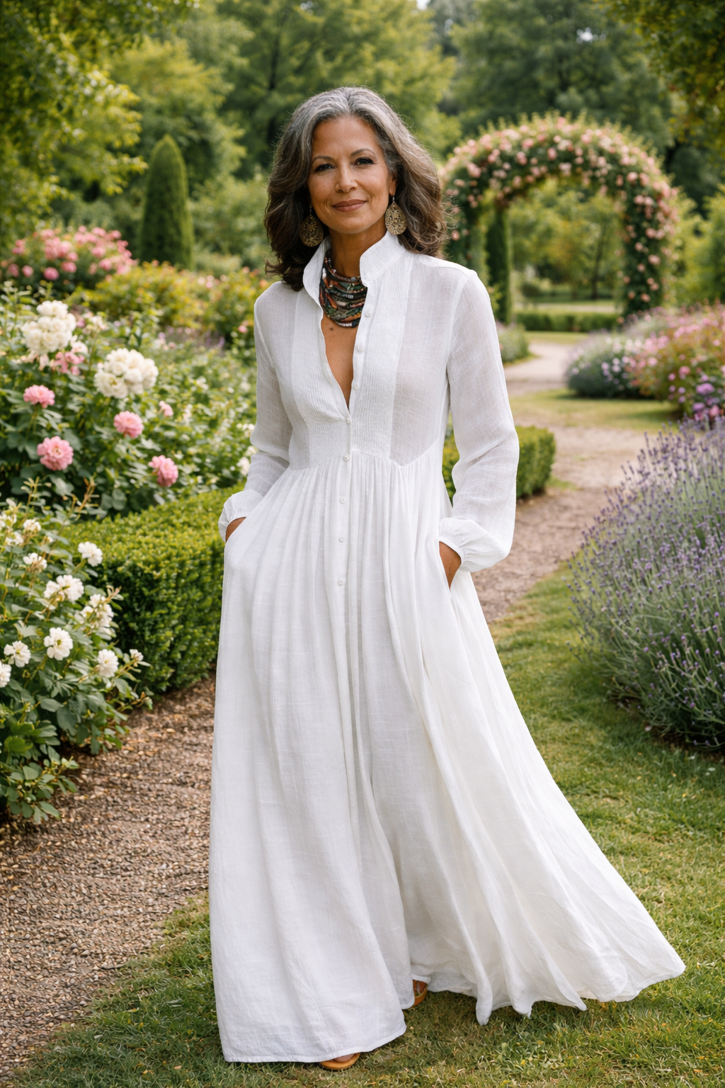 White linen maxi dress with button front, long sleeves and full skirt outdoors