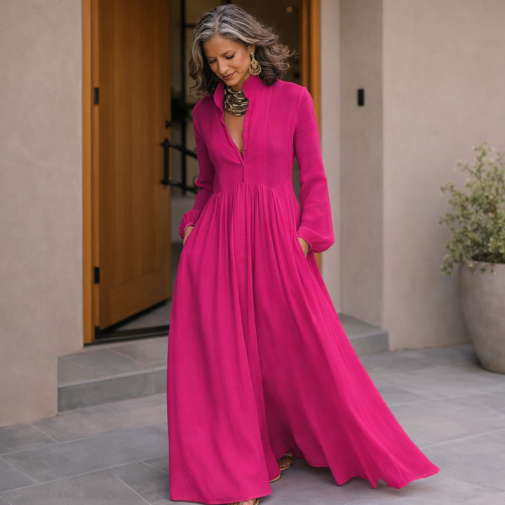 Dark pink button-front maxi dress with V-neckline and flowing tiered skirt