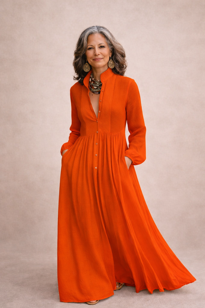 Orange button-front maxi dress with long sleeves and gathered waist