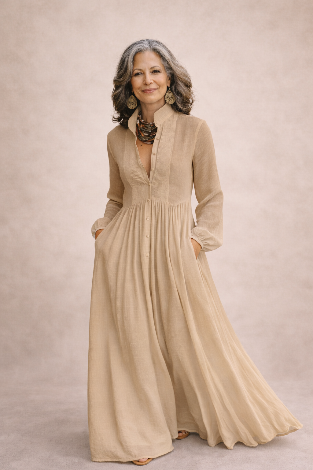 Tan button-front flowing maxi dress with long sleeves and gathered waist