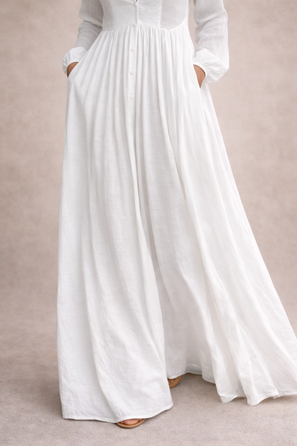 White maxi dress front with buttons and pleated, gathered waist