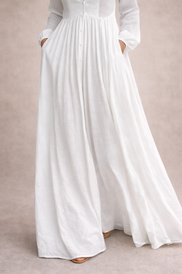 White maxi dress front with buttons and pleated, gathered waist