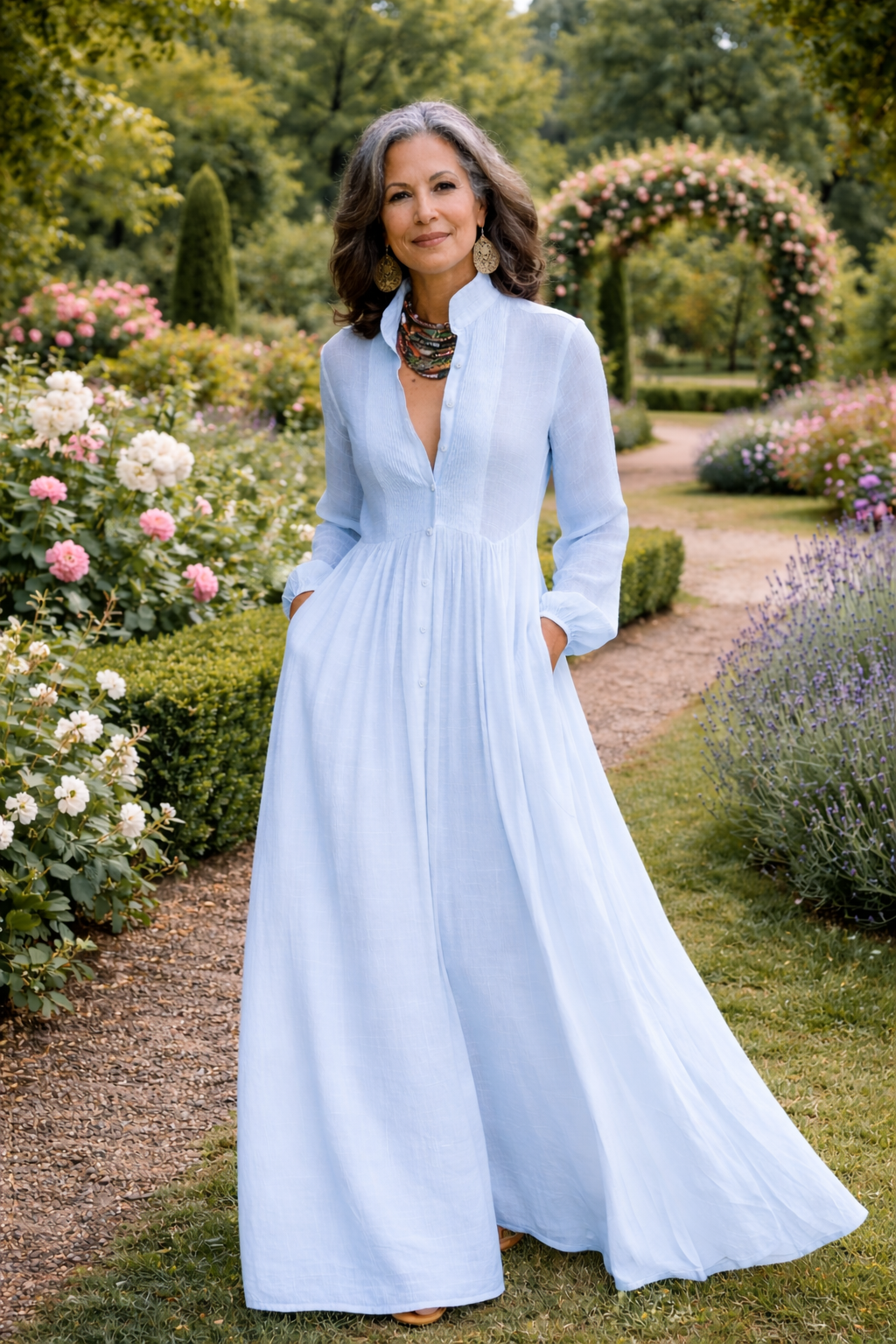 Flowing light blue button-front maxi dress with V-neck, long sleeves and gathered skirt