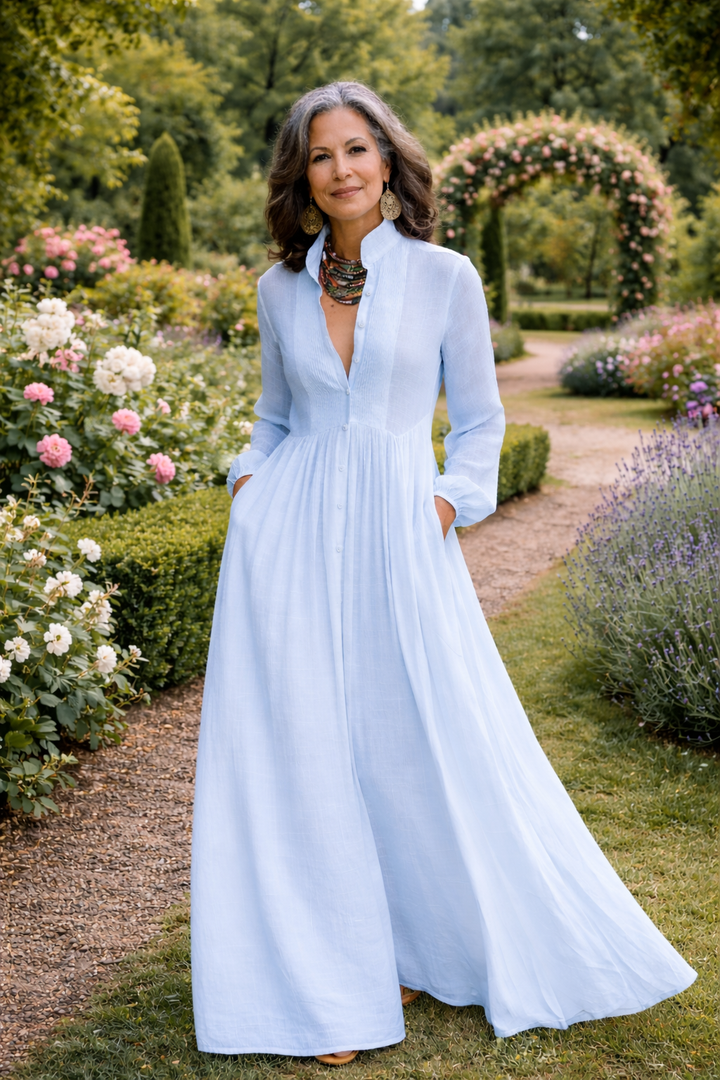 Flowing light blue button-front maxi dress with V-neck, long sleeves and gathered skirt