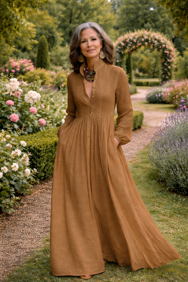 Brown button-front maxi dress with long sleeves, V-neck, and gathered waist