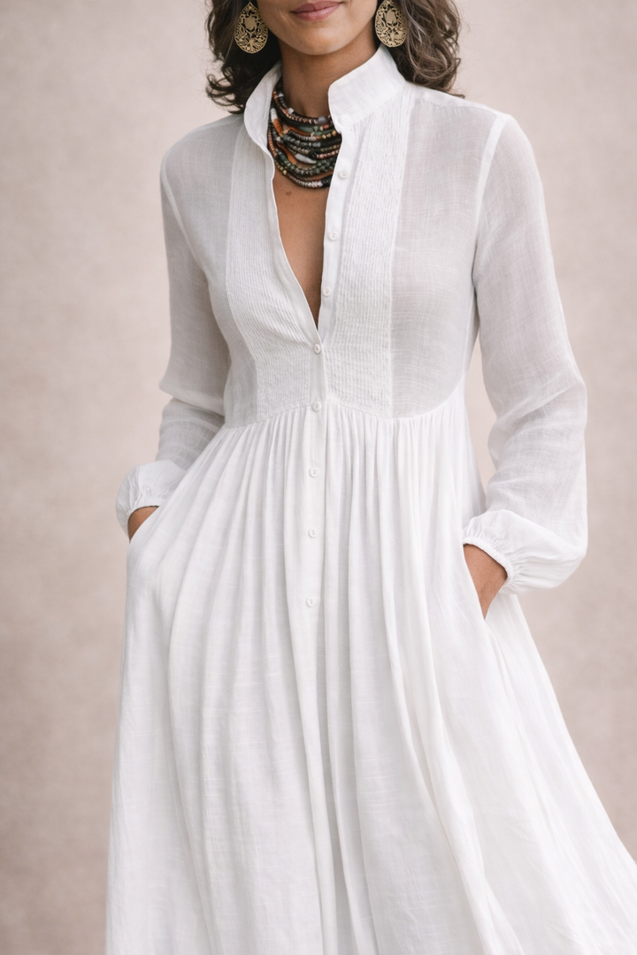 White button-front maxi dress with V-neck and long sleeves, gathered skirt detail
