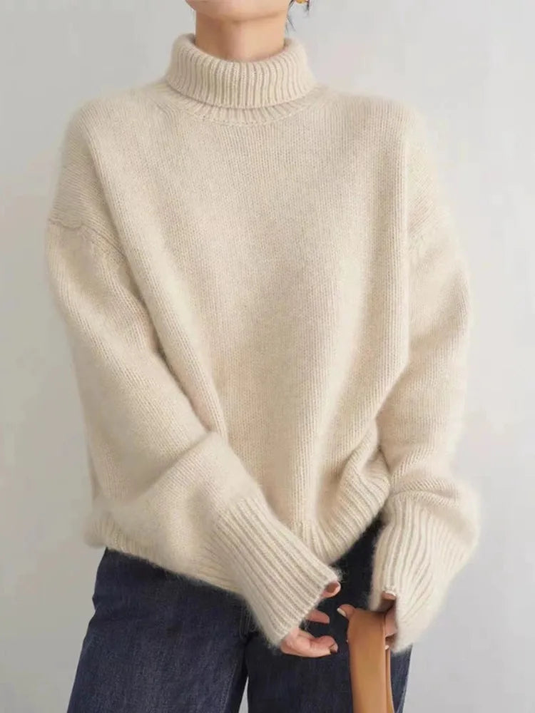 Beige oversized turtleneck sweater with high ribbed neck and long sleeves