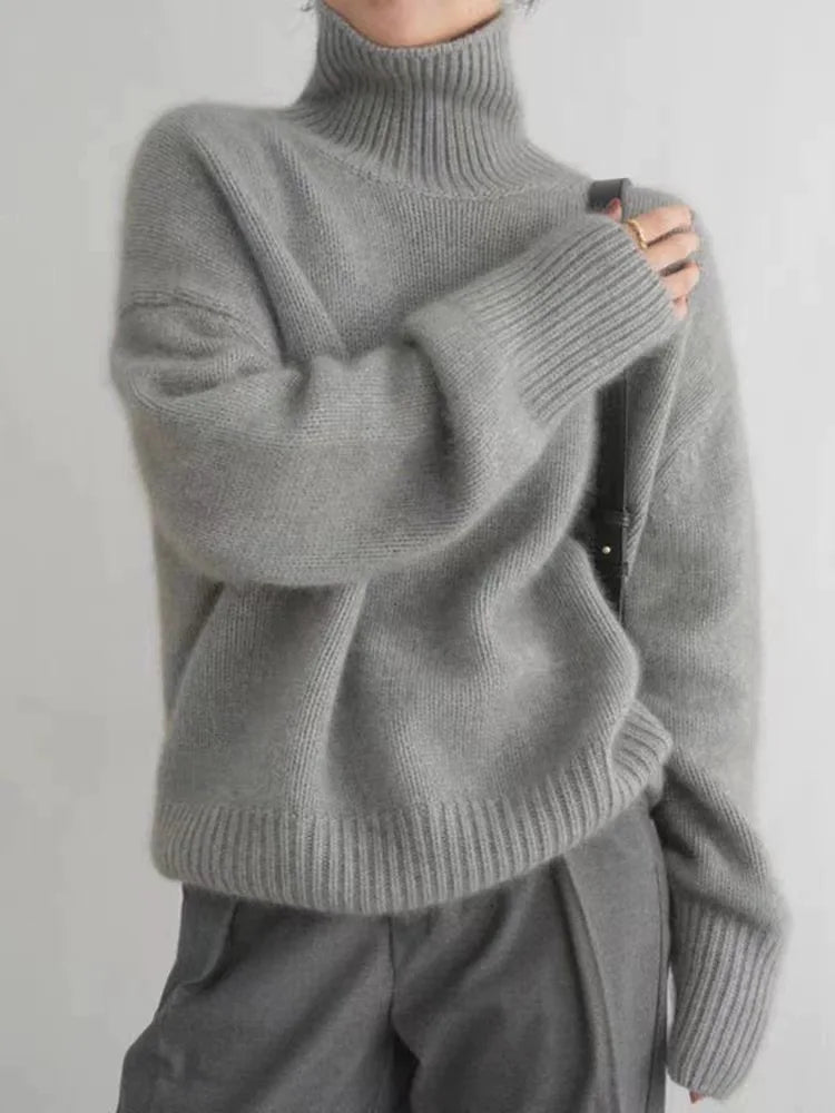 Gray oversized turtleneck sweater with chunky ribbed cuffs and neckline