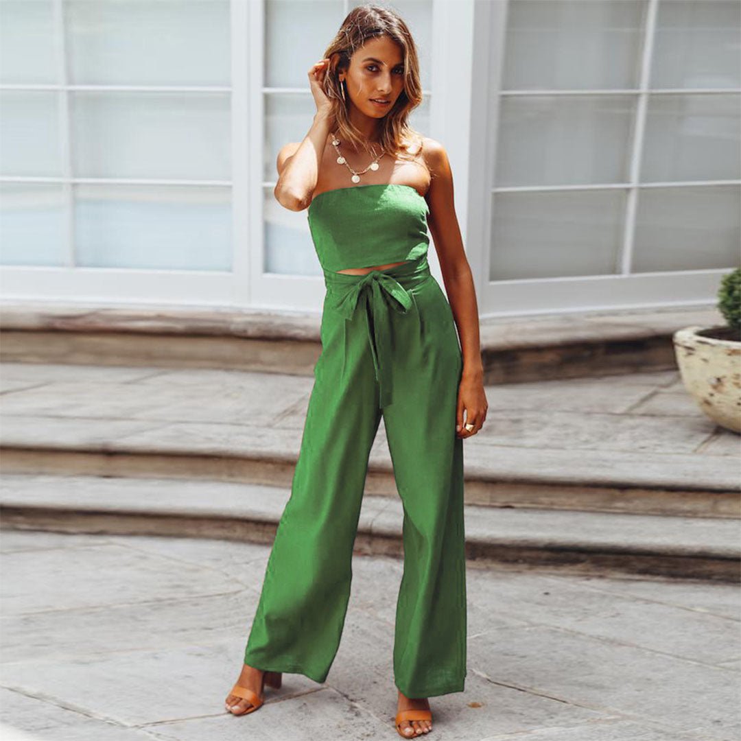 Green strapless tie-waist jumpsuit with waist bow and wide, flowing legs