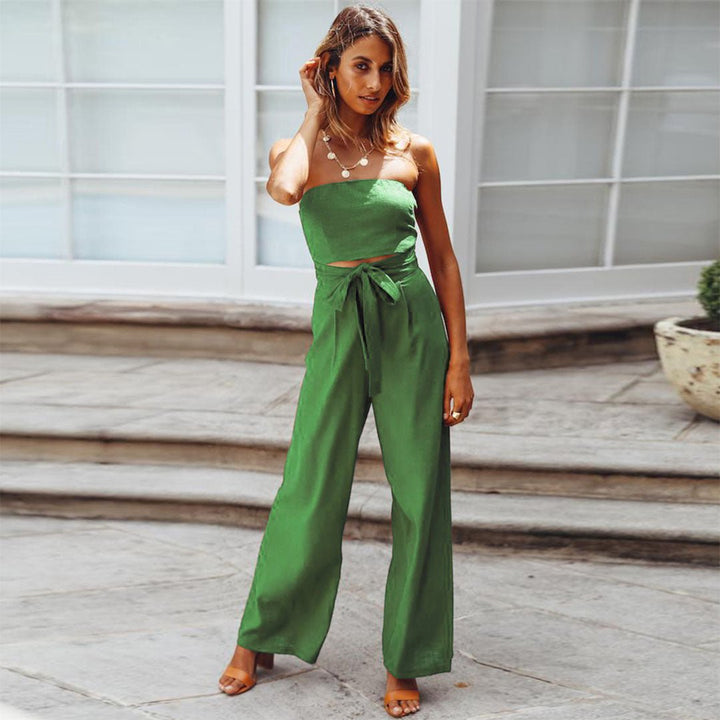 Green strapless tie-waist jumpsuit with waist bow and wide, flowing legs