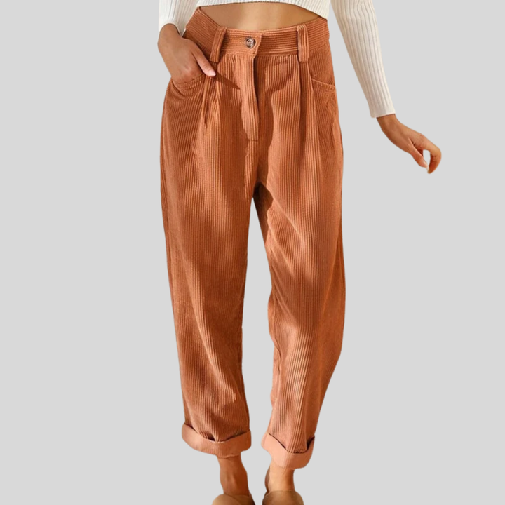 Relaxed corduroy pants in orange with button front, side pockets, and cuffed hems