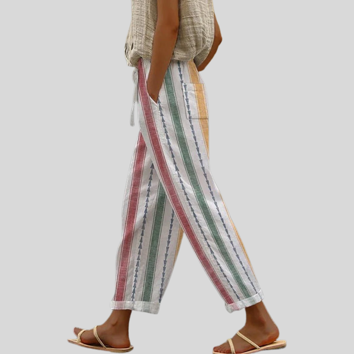 Striped relaxed pants with vertical multicolor stripes and ankle-length loose fit, drawstring ties