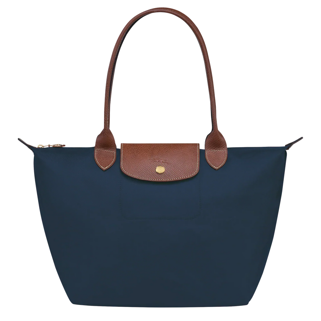 Navy medium nylon tote with brown leather trim, front flap pocket and snap