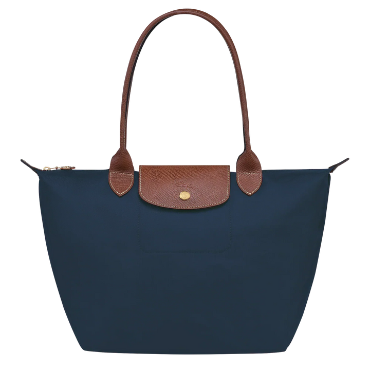 Navy medium nylon tote with brown leather trim, front flap pocket and snap