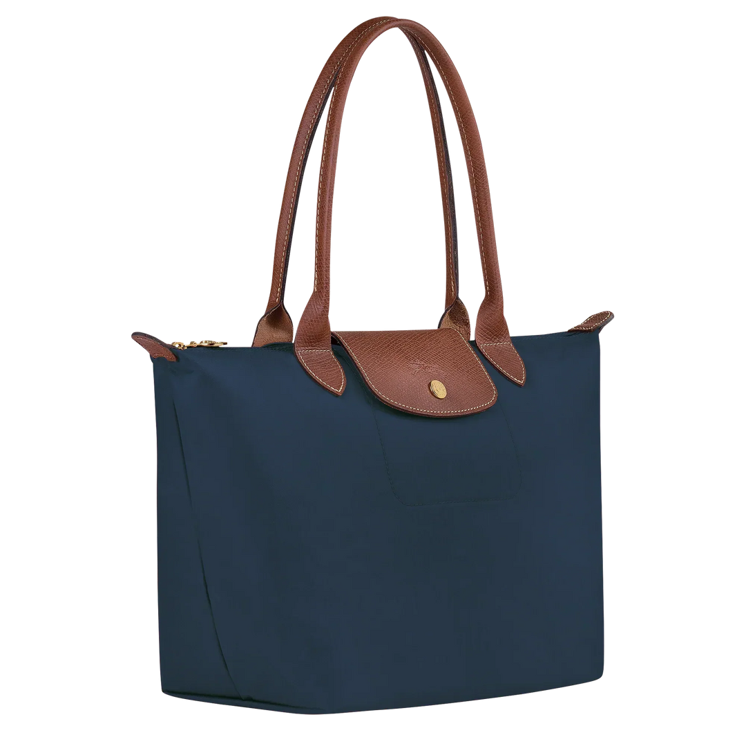 Navy medium nylon tote with brown leather handles and front flap pocket