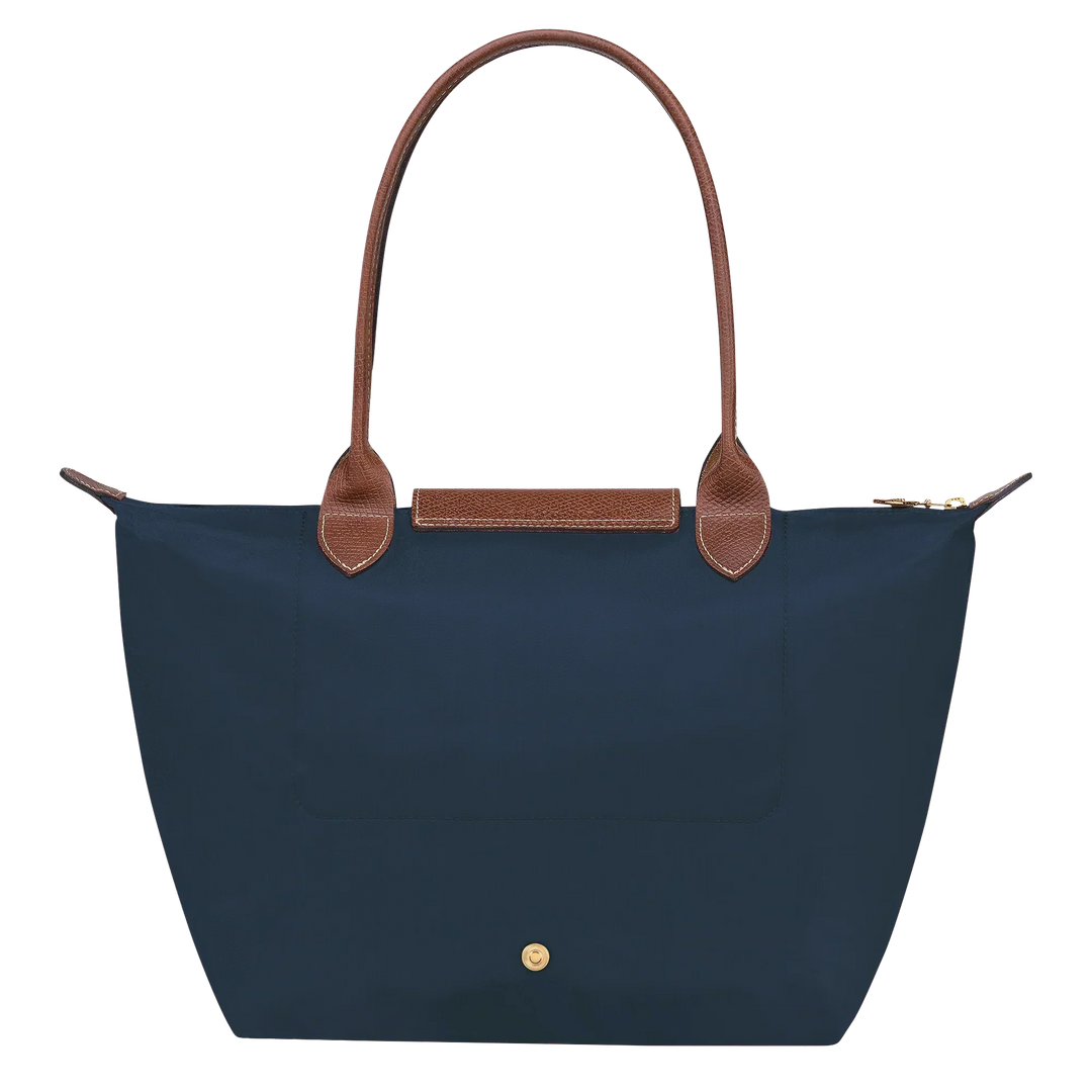 Navy medium nylon tote with brown leather handles and back snap pocket