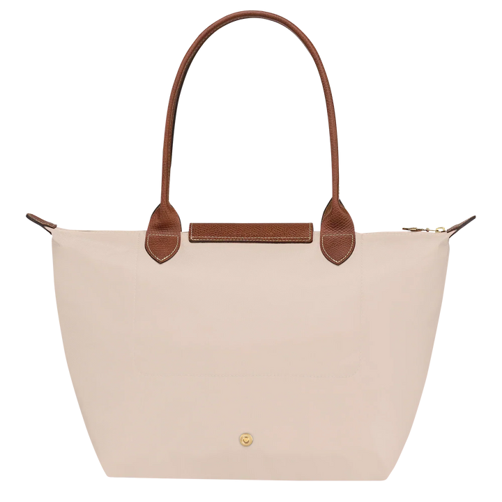 Cream canvas medium tote bag with brown leather trim and front pocket detail