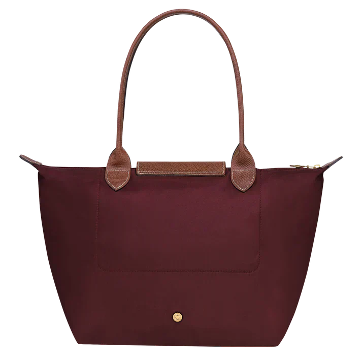 Burgundy medium nylon tote bag with front snap closure and gold button