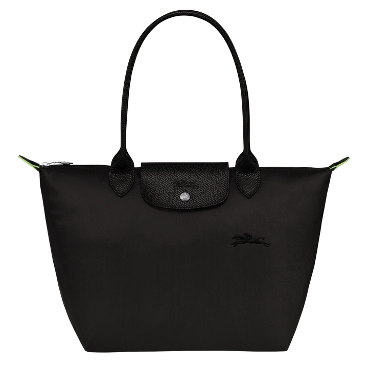 Black nylon medium tote bag with top handles, front flap pocket, and green piping accents