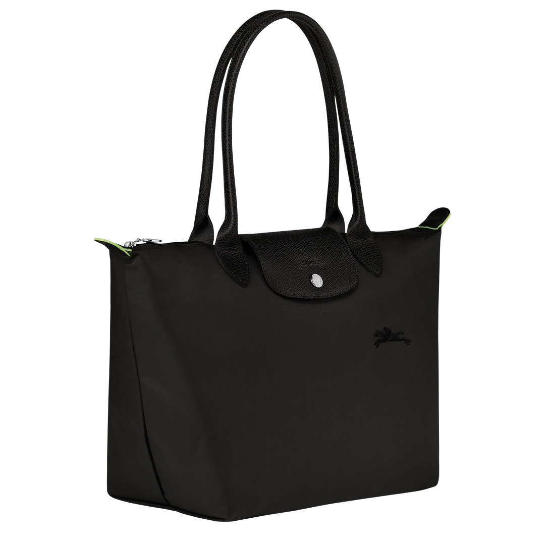 Black nylon tote bag with top handles, front logo, and green piping accents