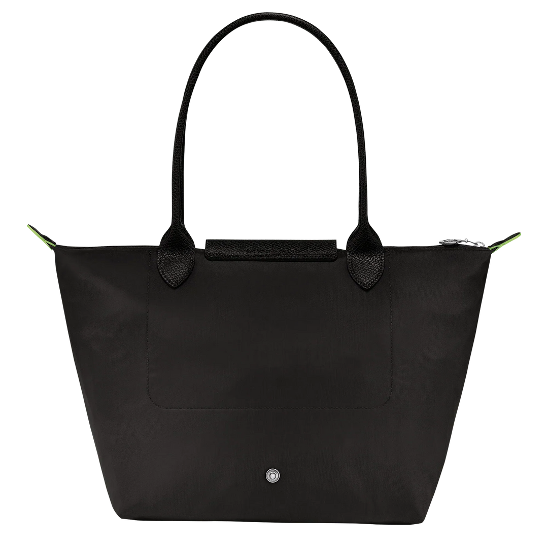 Black nylon medium tote bag with top handles, front pocket panel, and snap button