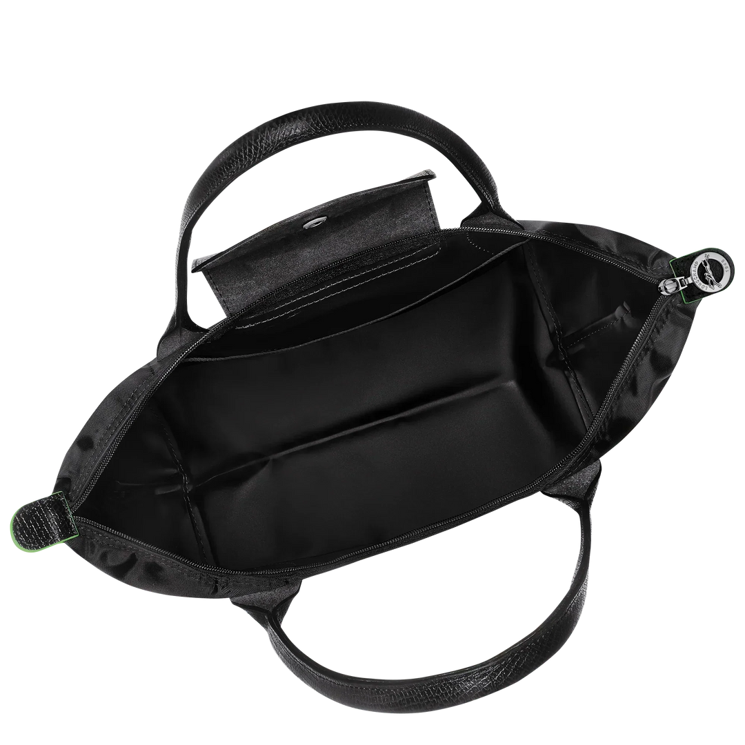 Black nylon tote bag interior with zippered top opening and two inner side compartments