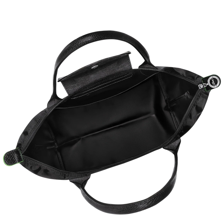 Black nylon tote bag interior with zippered top opening and two inner side compartments