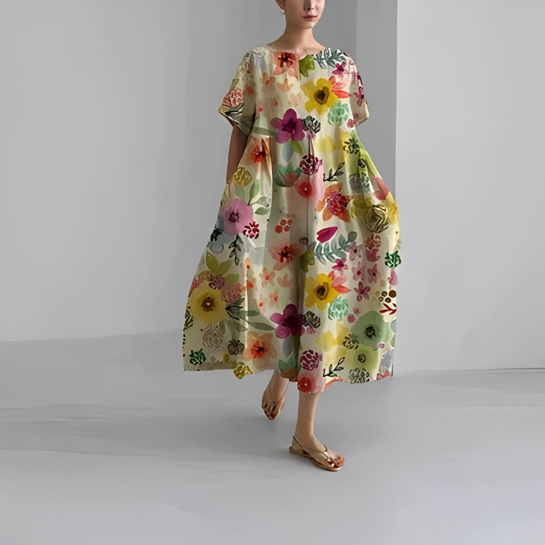 Floral flow dress in light cream with multicolor blossoms, loose midi, short sleeves.