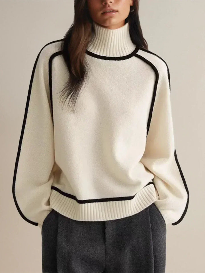 White luxe trim turtleneck sweater with black-trim neckline, hem, and cuffs