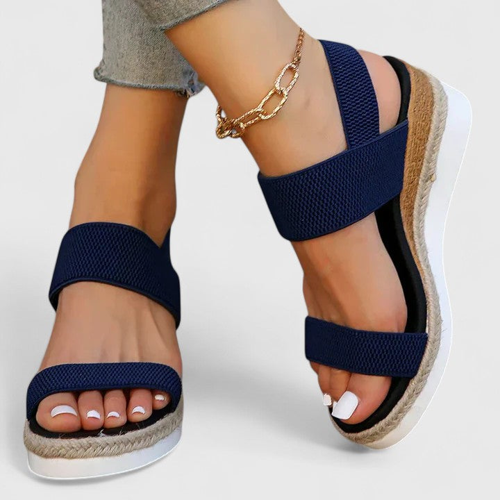 Women’s orthopedic sandals with arch support, navy two-strap sandals with gold ankle chain.