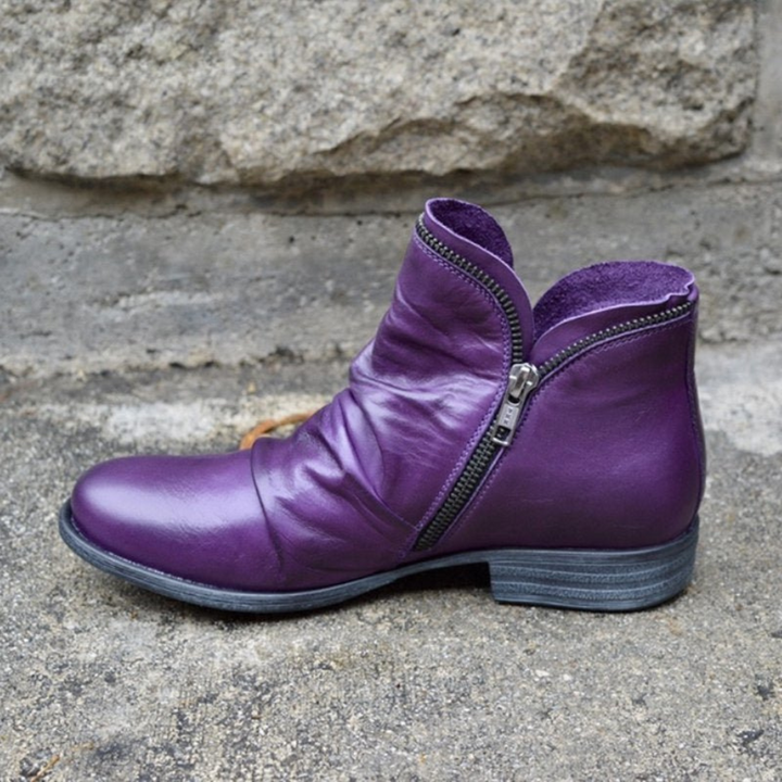 Purple side-zip ankle boots with low stacked heel and silver zipper hardware