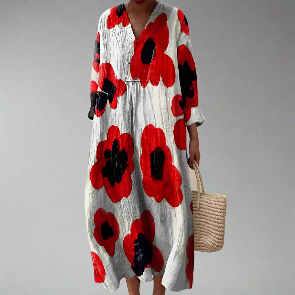 Long-sleeve midi dress with oversized red and black flower print on light fabric