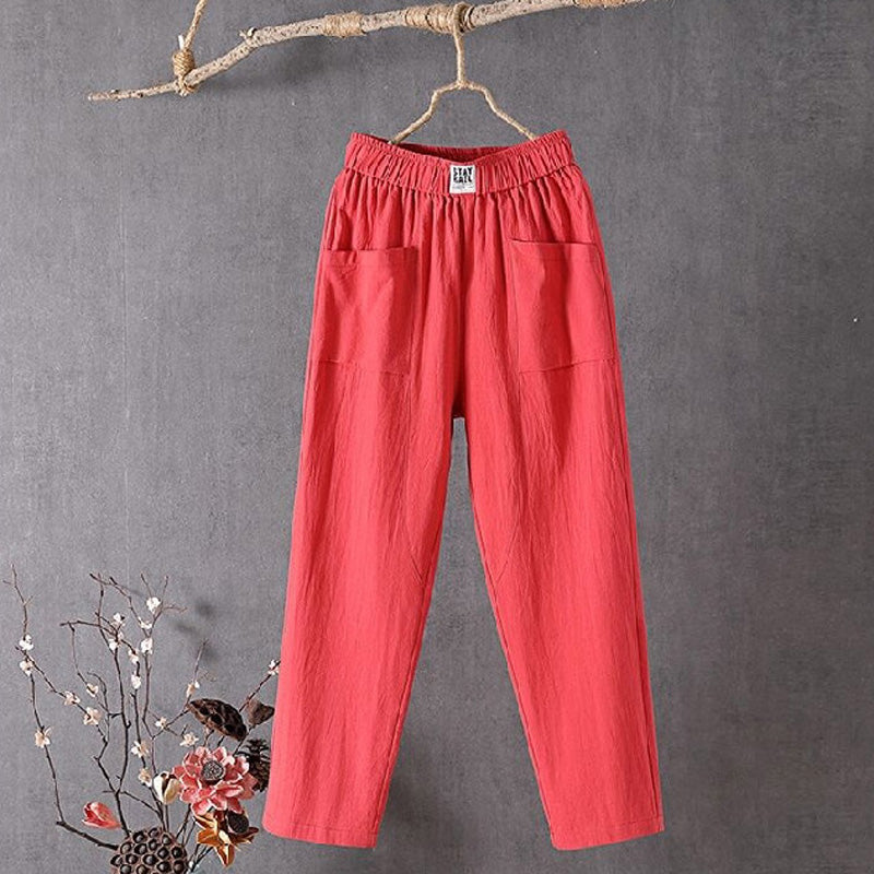 Red relaxed pocket pants with elastic waistband and two side patch pockets.