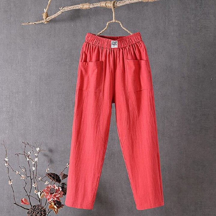 Red relaxed pocket pants with elastic waistband and two side patch pockets.