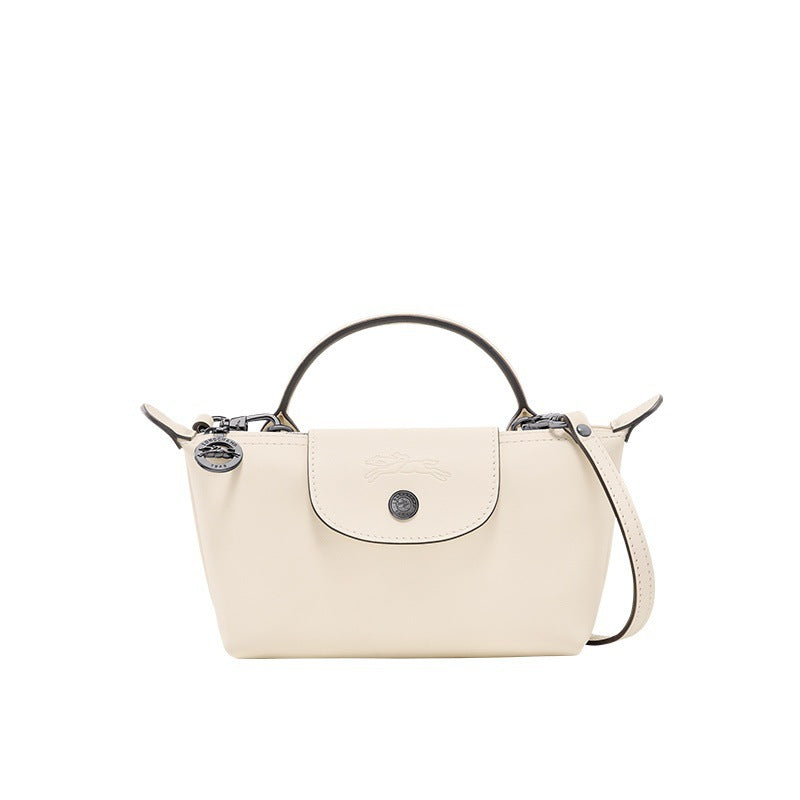 White mini leather tote bag with top handle, crossbody strap, front flap and logo button