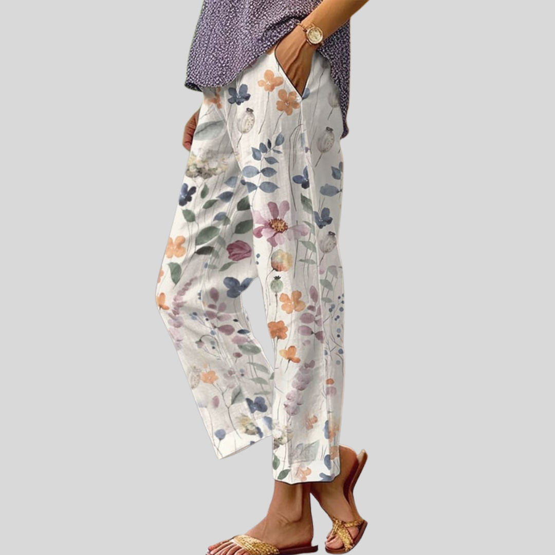 Floral relaxed pants with light background and multicolor blossoms and leaves