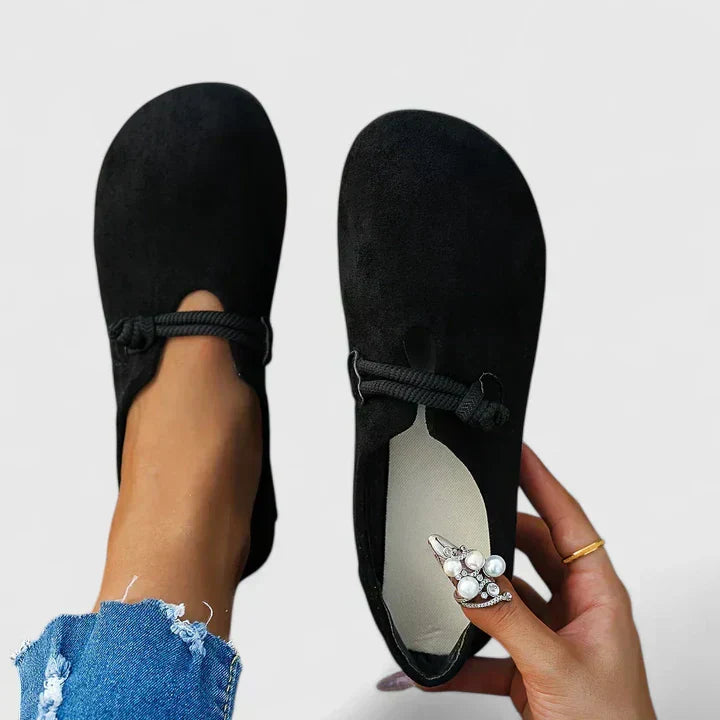 Women's black comfort slip-on shoes with tied elastic laces and suede upper