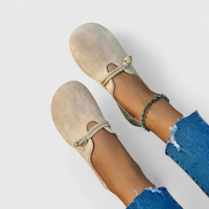 Women's beige slip-on shoes with tied elastic laces and suede upper