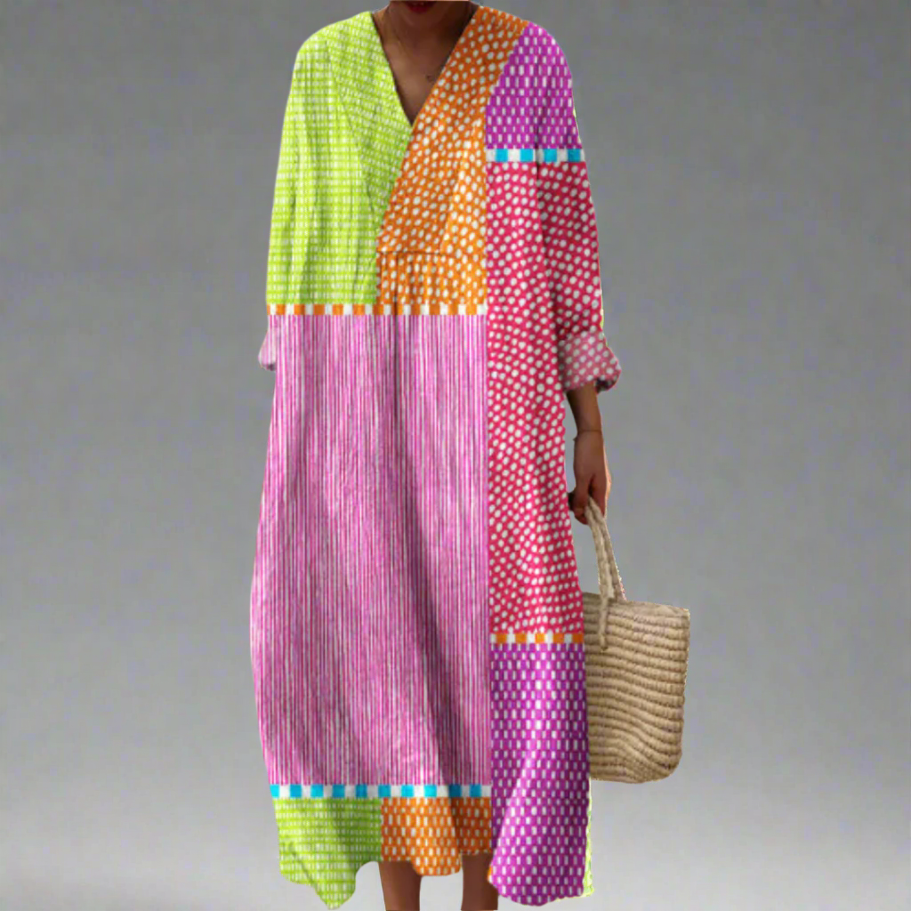 Geometric patchwork dress with V-neck and long sleeves in green, orange, pink and purple.