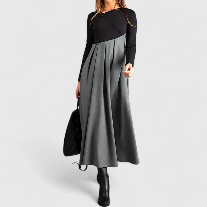 Pleated contrast maxi dress with black long sleeves and gray pleated skirt panel