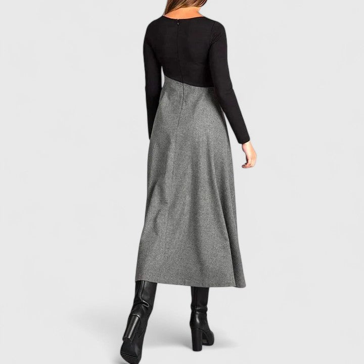 Pleated contrast maxi dress back view: black yoke and gray pleated skirt