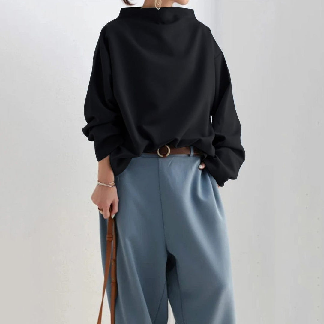 Black minimal high-neck sweater with long cuffed sleeves and relaxed shape