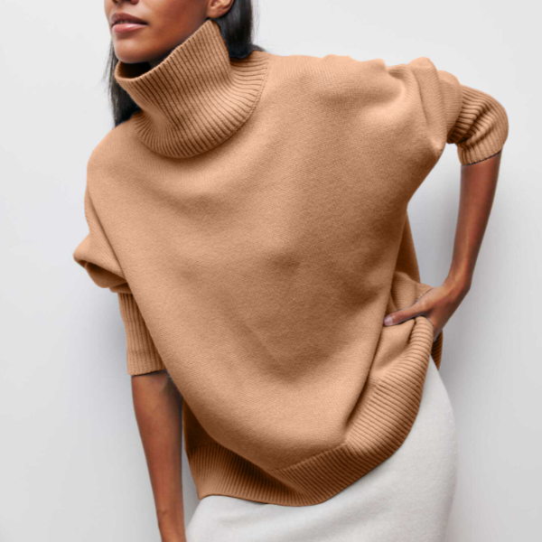 Tan turtleneck knit sweater with ribbed collar and cuffs, relaxed fit.