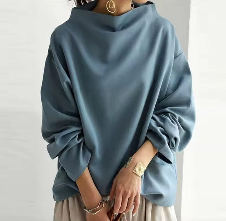 Blue high-neck minimal sweater with loose fit and wide batwing sleeves