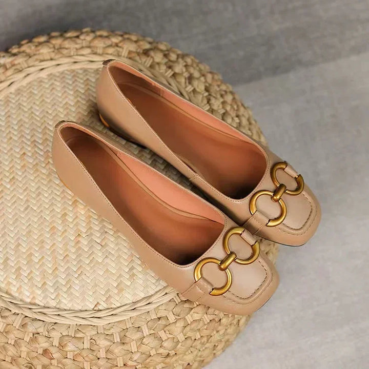 Beige ballet flats set with gold chain-link detail and slip-on design