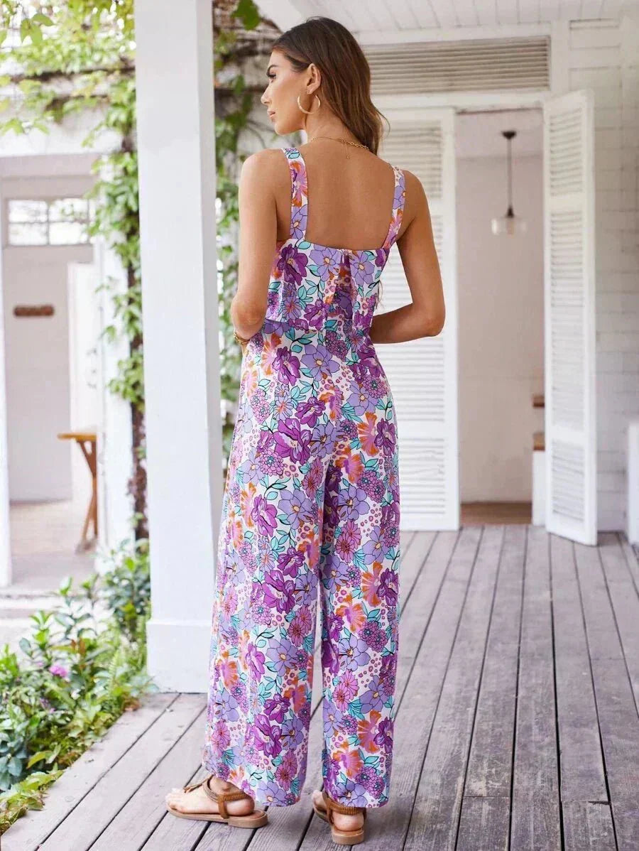 Purple floral wide-leg jumpsuit from back view with open scoop back.